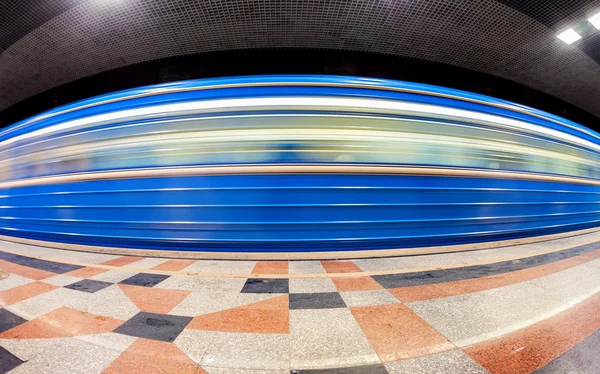 Blue subway train in motion at the underground station. Wide ang — Stock Photo, Image