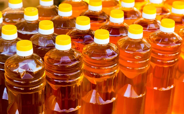Bottles of vegetable oil close up — Stock Photo, Image