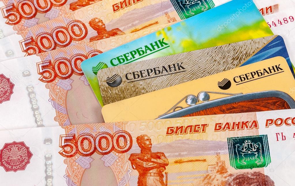 SAMARA, RUSSIA - APRIL 8, 2014: Photo of VISA and Mastercard credit card with russian rubles