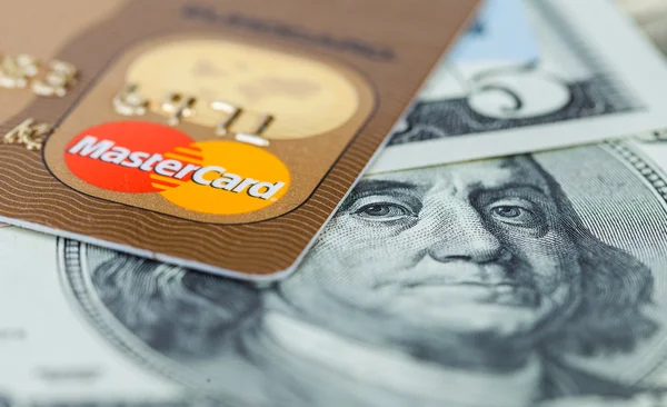 Photo of Mastercard credit card with american dollars — Stock Photo, Image