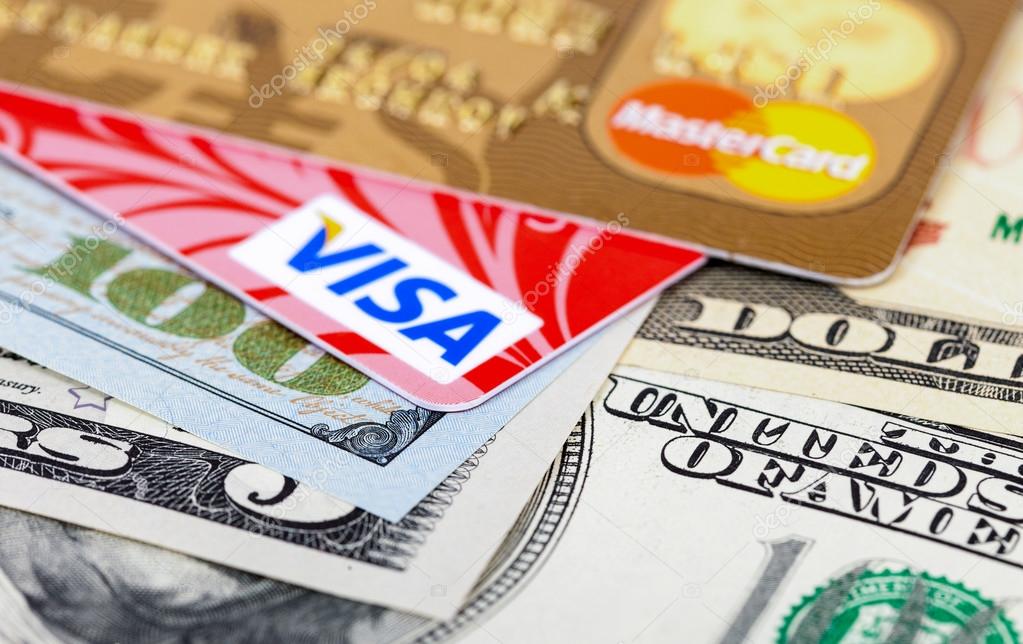SAMARA, RUSSIA - FEBRUARY 4, 2015: Photo of VISA and Mastercard credit card with american dollars