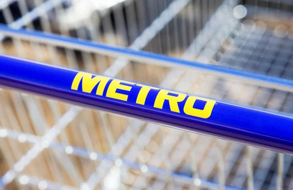 Large empty blue shopping cart Metro store — Stock Photo, Image