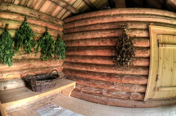 Birch brooms for a steam room in traditional russian wooden bath — Stock Photo, Image