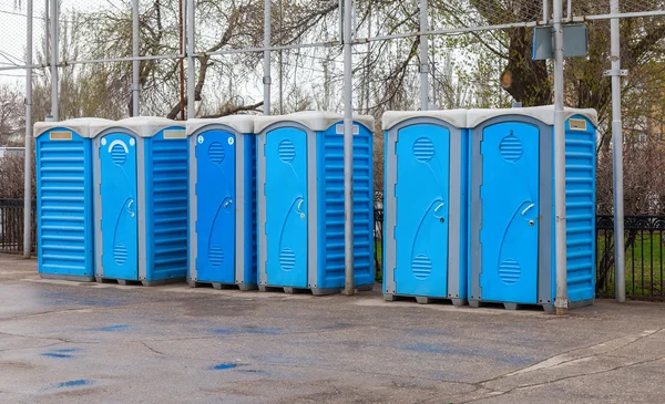Row of portable toilets on the outdoor Stock Image