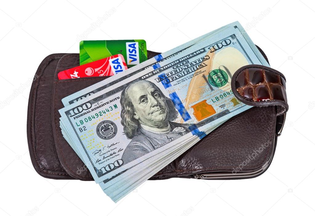SAMARA, RUSSIA - APRIL 17, 2015: Wallet with american dollars and credit cards, isolated on white