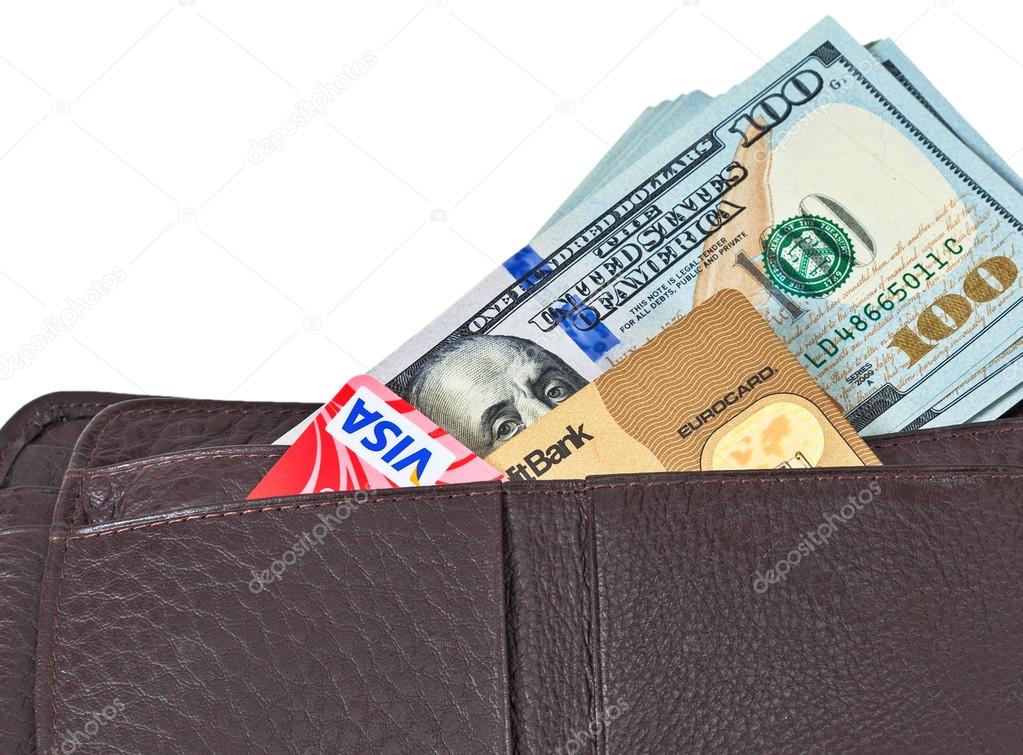 SAMARA, RUSSIA - APRIL 17, 2015: Wallet open with a dollar bill sticking out and credit card, isolated on white