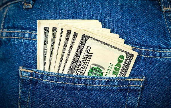 Banknotes of one hundred american dollars in the back jeans pock — Stock Photo, Image