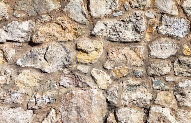 Arkaplan olarak gri bir taş duvar parçası