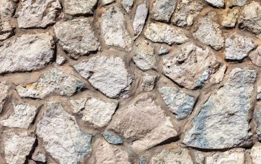 Arkaplan olarak gri bir taş duvar parçası