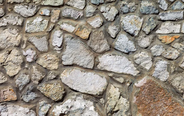 Fragment of a grey stone wall as background — Stock Photo, Image
