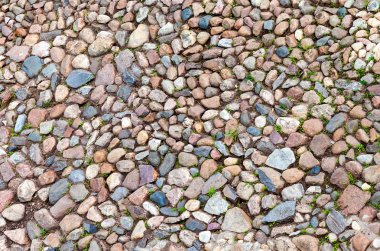 Fragment of the old natural stone wall as background