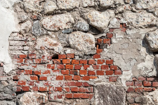 Fragment of a natural old stone wall as background — Stock Photo, Image