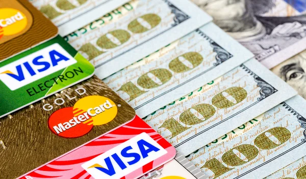 Mastercard Debit Card, Visa with US Dollar bills — Stock Photo, Image