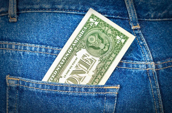 One american dollar sticking out of the jeans pocket — Stock Photo, Image