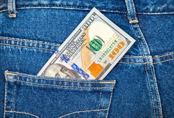 Banknote of one hundred american dollars in the back jeans pocke — Stock Photo, Image