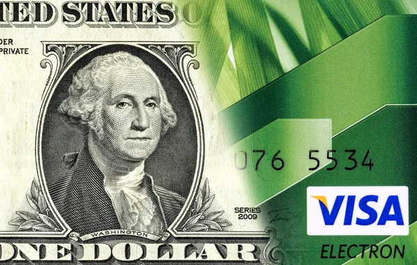 Biljet van één Amerikaanse dollar wordt geconverteerd naar een credit card. C — Stockfoto