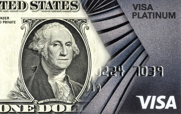 Банкнота один американський долар перетворюється на отримання кредитної картки. C — стокове фото