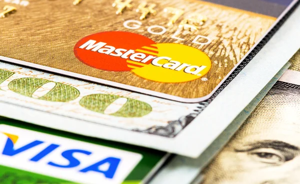 American dollar bills with credit cards Visa and MasterCard — Stock Photo, Image