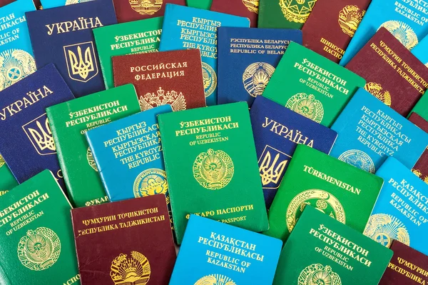 Different foreign passports as colorful background — Stock Photo, Image