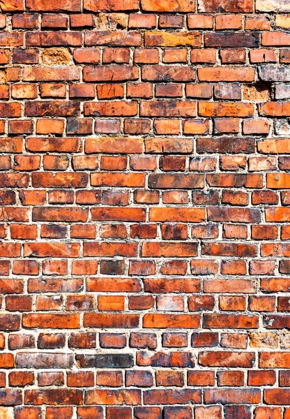 Oude verweerde rode bakstenen muur als achtergrond — Stockfoto