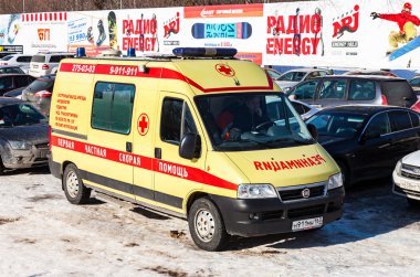 Ambulance car parked up in sunny day