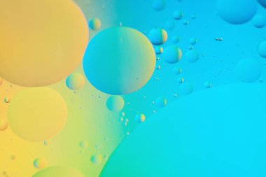 Mavi ve sarı soyut arkaplan resmi yağ, su ve sabundan yapıldı