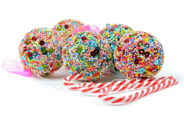 Christmas balls and candy canes — Stock Photo, Image
