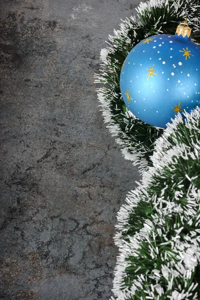 Christmas decorations - ball and spruce tinsel — Stock Photo, Image