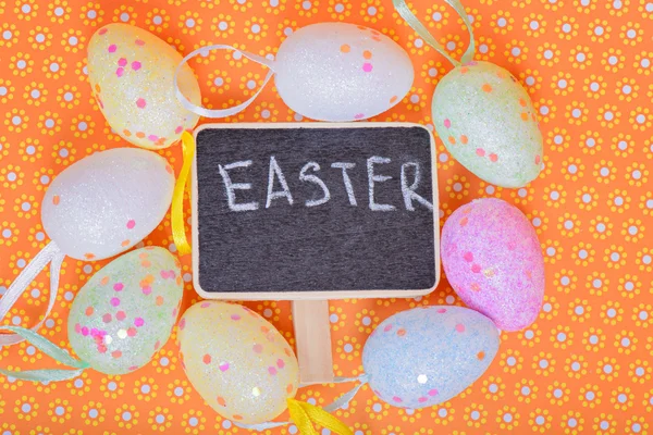 Easter eggs with chalkboard — Stock Photo, Image