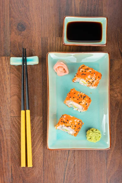 Sushi rolls on the wooden table. Aerial view. — Stock Photo, Image