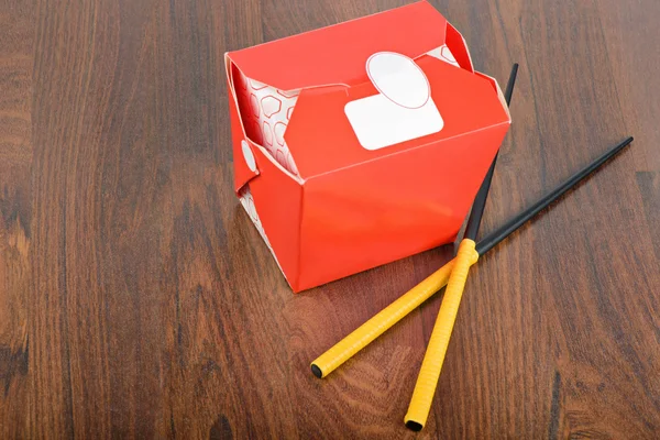 Chinese take away red food box with chopstocks — Stock Photo, Image