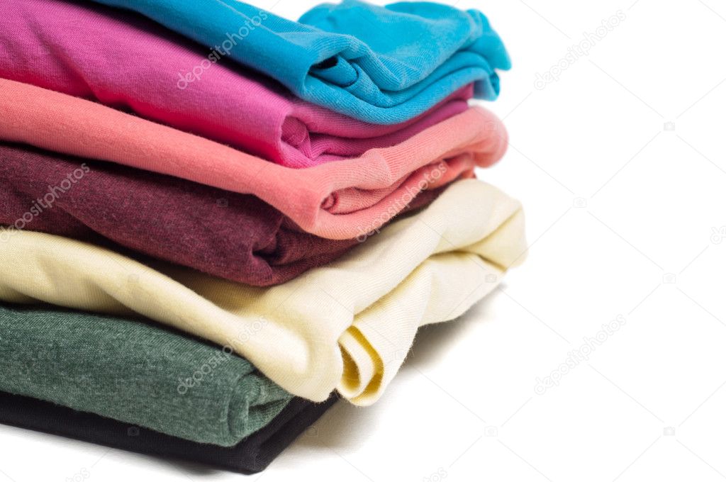 Closeup of pile of folded T shirts