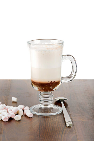 A glass of hot chocolate with marshmallows