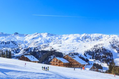 Skiers on the slopes of the ski resort of Meriber. France clipart