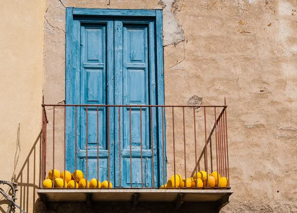 Balcony with yellow melons. Sicily. Italy — Stock Photo, Image