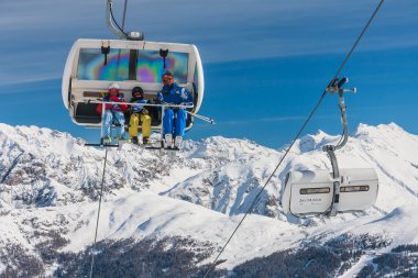LIVIGNO, ITALY - JANUARY 28, 2015: Ski lift and ski slopes in the mountains of winter resort Livigno, Lombardi, January 28, 2015, Italy. Livigno is  developing ski resort in northern Italy