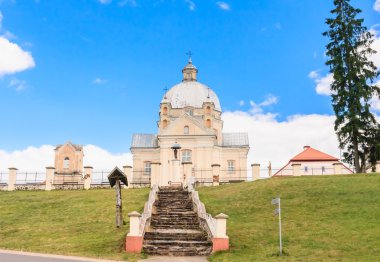 The road to the temple. Catholic church of the Holy Trinity. Lis