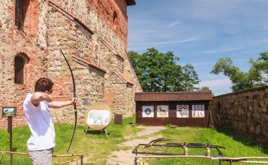 Archery. Attraction in the territory of Trakai Castle. Lithuania clipart