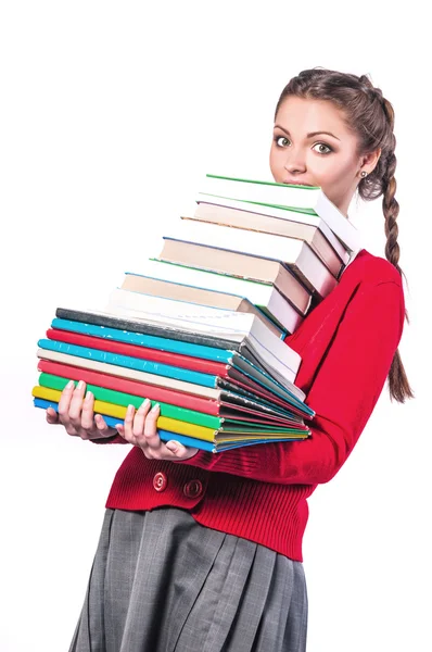 Ragazza in piedi con un mucchio di libri — Foto Stock