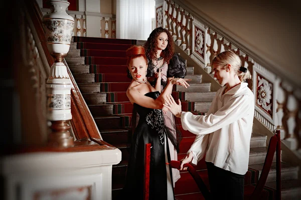 Beautiful two women and a man in the clothing of the 18th centur — Stock Photo, Image