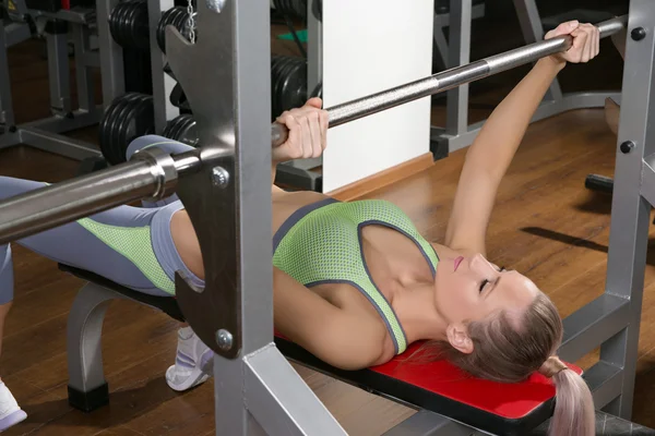 Sports background. Muscular fit woman exercising. — Stock Photo, Image