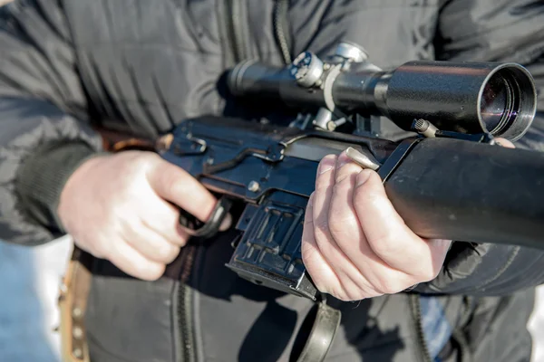 Soldier or sniper holding gun with virtual screen projection and — Stock Photo, Image