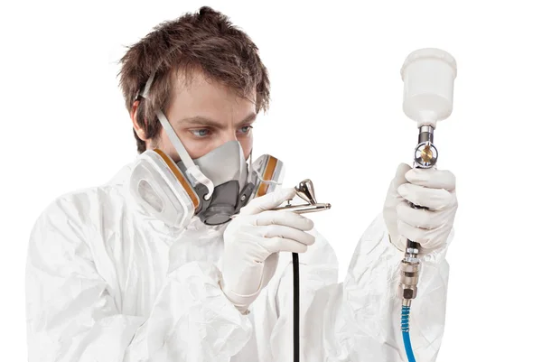 Worker with airbrush gun — Stock Photo, Image