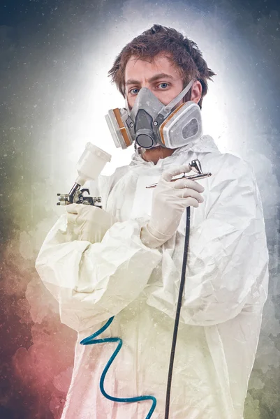 Worker with airbrush gun — Stock Photo, Image