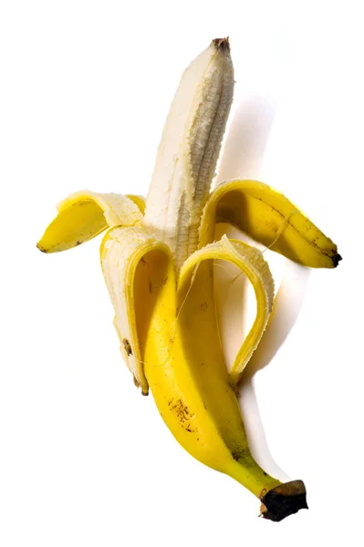 Banana descascada em um fundo branco — Fotografia de Stock