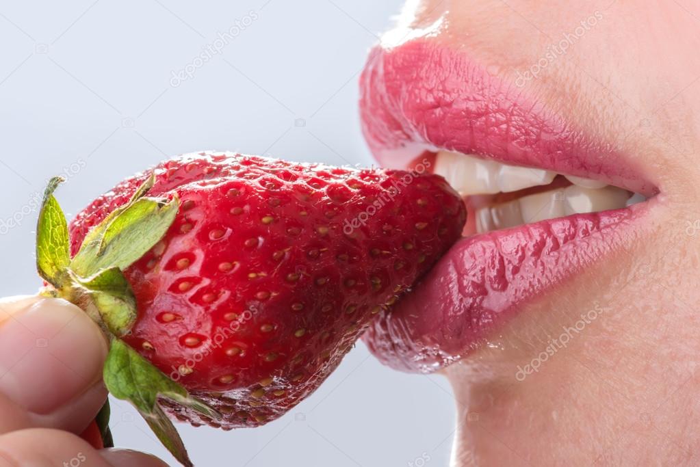 woman eat strawberry