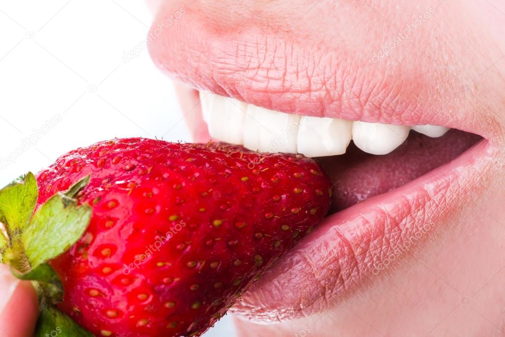 woman eat strawberry