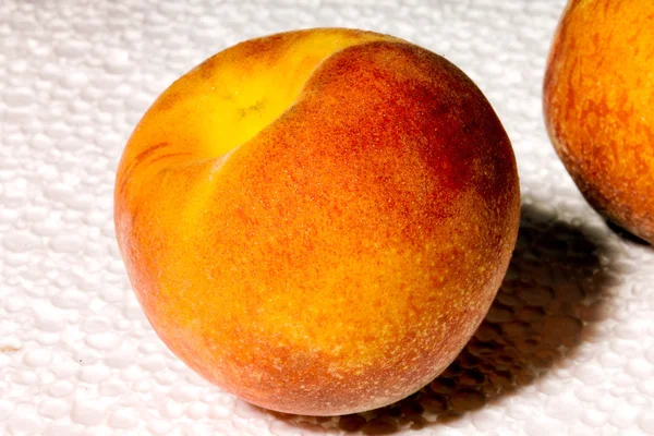 Peach on a light background — Stock Photo, Image