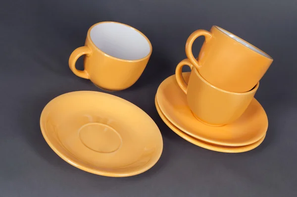 Tasse orange et soucoupe — Photo