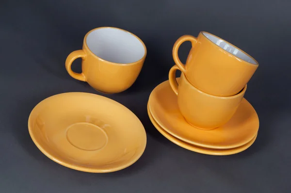 Oranžový šálek a talířek — Stock fotografie